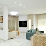 Spacious modern living room with elegant sofas and stylish decor.